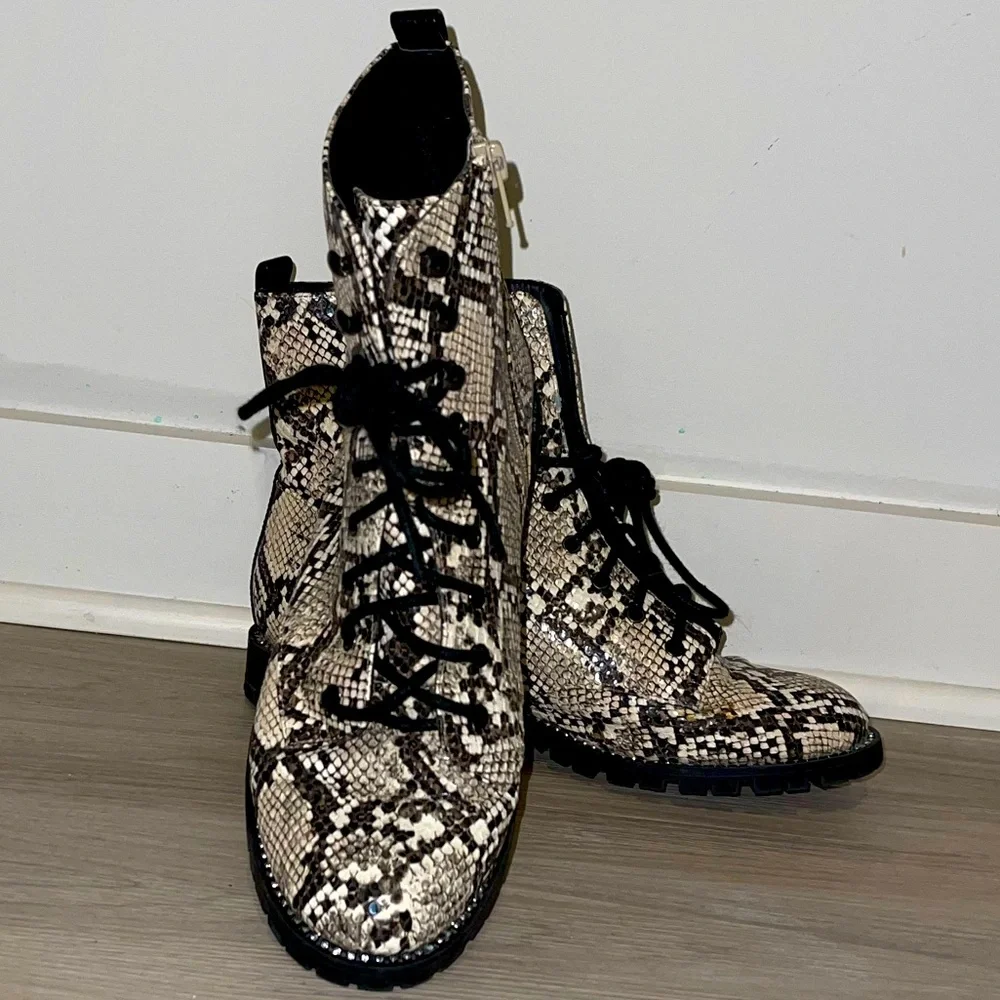 Express snakeskin combat booties. Rhinestone embellishing around sole. - Picture 1 of 10